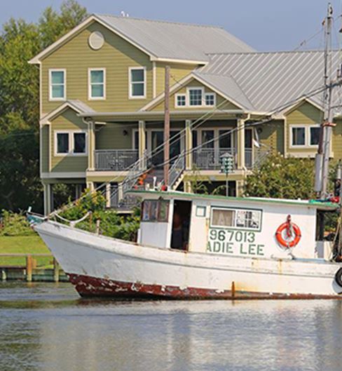 Boat docked near a house